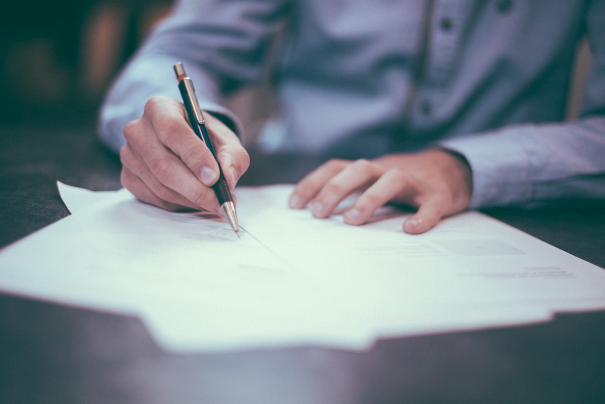Independent contractor reviewing mortgage documents at a desk